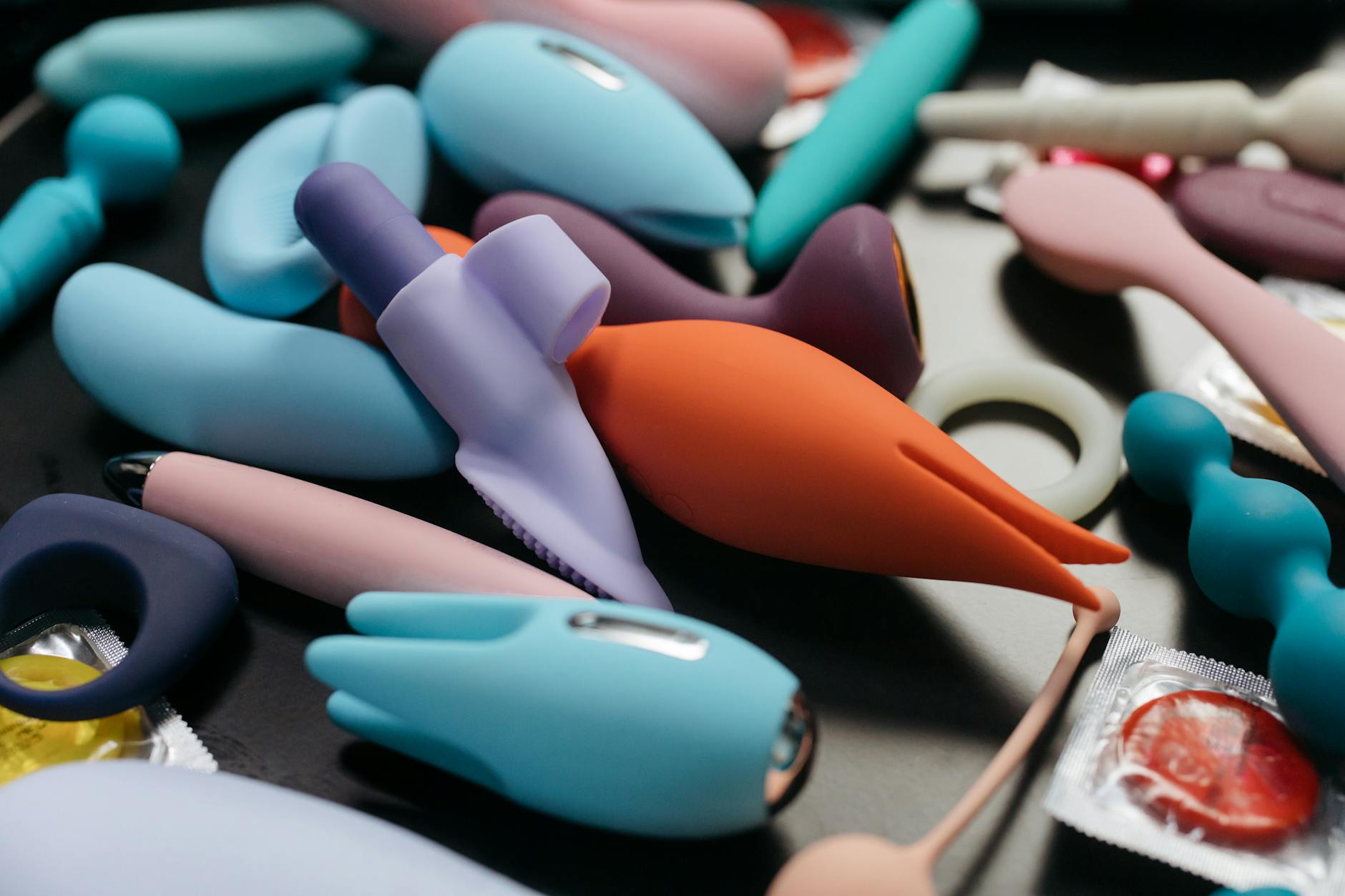 An array of vibrant clitoral toys and vibrators displayed close-up